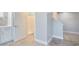 Bright bathroom featuring a walk-in shower and stylish neutral tile floors at 125 Oak Bay Dr., Georgetown, SC 29440