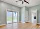 Bright bedroom with outside access, hardwood floors, ceiling fan, and access to the other rooms at 125 Oak Bay Dr., Georgetown, SC 29440