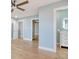 A bright and airy bedroom with light blue walls and multiple doors leading to different spaces at 125 Oak Bay Dr., Georgetown, SC 29440