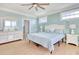 Tranquil bedroom featuring a ceiling fan, light blue walls, and two windows for ample natural light at 125 Oak Bay Dr., Georgetown, SC 29440