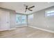 A bedroom bathed in soft light and featuring light-colored wood floors and windows at 125 Oak Bay Dr., Georgetown, SC 29440