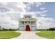 Beautiful two-story home with a double garage, red stairway, and white railings at 125 Oak Bay Dr., Georgetown, SC 29440
