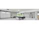 Spacious garage with a jet ski, tall ceilings, and a garage door at 125 Oak Bay Dr., Georgetown, SC 29440