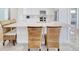 Kitchen island with seating overlooking the open kitchen with stainless appliances and tile flooring at 125 Oak Bay Dr., Georgetown, SC 29440