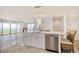 Modern kitchen island featuring stone countertop, stainless dishwasher and wicker chairs at 125 Oak Bay Dr., Georgetown, SC 29440