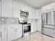 Modern kitchen featuring stainless steel appliances, white cabinets, and light marble countertops at 125 Oak Bay Dr., Georgetown, SC 29440