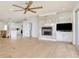 Bright living room with fireplace opens to the kitchen with modern amenities and design at 125 Oak Bay Dr., Georgetown, SC 29440