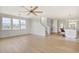 Bright living area with large windows and hardwood floors adjacent to kitchen area at 125 Oak Bay Dr., Georgetown, SC 29440