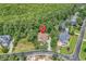 Aerial view of a home surrounded by tall trees at 128 Knotty Pine Way, Murrells Inlet, SC 29576