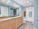 Well-lit bathroom with double sink vanity and shower at 128 Knotty Pine Way, Murrells Inlet, SC 29576