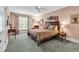 This is a spacious bedroom with a ceiling fan and a large window at 128 Knotty Pine Way, Murrells Inlet, SC 29576