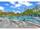Large community pool with lounge chairs, umbrellas, and well-maintained landscaping at 128 Knotty Pine Way, Murrells Inlet, SC 29576