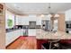 Modern kitchen featuring stainless steel appliances, ample counter space, and a stylish center island at 128 Knotty Pine Way, Murrells Inlet, SC 29576