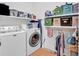 Bright and functional laundry room with modern washer/dryer, storage shelves, and hanging rack at 128 Knotty Pine Way, Murrells Inlet, SC 29576