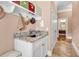 Convenient mud room with sink, granite counters, and decorative cabinets at 128 Knotty Pine Way, Murrells Inlet, SC 29576