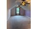 Spacious carpeted bedroom featuring a window, neutral walls and two ceiling fans for added comfort at 140 Blue Pride Dr., Loris, SC 29569