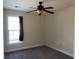 Bedroom featuring a window with natural light, a ceiling fan, and neutral-colored walls at 140 Blue Pride Dr., Loris, SC 29569