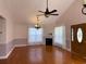 Spacious living room featuring a fireplace, hardwood floors, and bright windows at 140 Blue Pride Dr., Loris, SC 29569