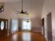 Spacious living room with hardwood floors, lots of windows and vaulted ceilings at 140 Blue Pride Dr., Loris, SC 29569