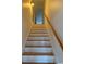 Staircase with wood and white risers and a wood handrail at 140 Blue Pride Dr., Loris, SC 29569