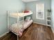 Charming bedroom featuring bunk beds, a window and shelf storage at 147 Weatherboard Ct., Pawleys Island, SC 29585