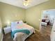 Cozy bedroom with seahorse decor, adjoining a living area, and nice hard wood flooring at 147 Weatherboard Ct., Pawleys Island, SC 29585