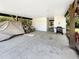Spacious carport featuring outdoor seating, a grill, and vehicle storage at 147 Weatherboard Ct., Pawleys Island, SC 29585