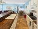 Well-lit kitchen with white cabinetry, wood countertops, and seamless flow into the living area at 147 Weatherboard Ct., Pawleys Island, SC 29585