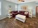 Inviting living room with a red sectional couch, white coffee table, and decorative wall art at 147 Weatherboard Ct., Pawleys Island, SC 29585