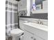 Bathroom with white vanity and sink, toilet, and mirror cabinet at 1710-C Edge Dr., North Myrtle Beach, SC 29582
