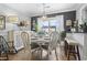 Bright dining area featuring stylish chairs, modern lighting, and access to the backyard at 1710-C Edge Dr., North Myrtle Beach, SC 29582