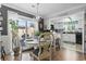 Charming dining area with backyard access, stylish seating, and an open view to the kitchen at 1710-C Edge Dr., North Myrtle Beach, SC 29582