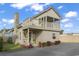 Charming exterior elevation featuring a second-story balcony, brick chimney, and colorful potted plants at 1710-C Edge Dr., North Myrtle Beach, SC 29582