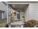 Charming front porch decorated with plants and a chair creating an inviting entrance at 1710-C Edge Dr., North Myrtle Beach, SC 29582