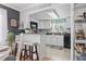 Bright kitchen with white cabinetry, modern appliances, and an open view to the dining area at 1710-C Edge Dr., North Myrtle Beach, SC 29582