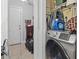 Convenient laundry room with modern washer and dryer for easy chore days and organized utility storage at 1710-C Edge Dr., North Myrtle Beach, SC 29582