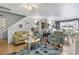 Cozy living room with hardwood floors, comfortable seating, and access to dining area at 1710-C Edge Dr., North Myrtle Beach, SC 29582