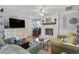 Well-lit living room with a decorative brick fireplace, hardwood floors, and stylish decor at 1710-C Edge Dr., North Myrtle Beach, SC 29582
