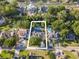 Aerial view showcasing the backyard pool and lush greenery of this home's serene location at 174 Edward Ave., Murrells Inlet, SC 29576