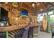 Cozy outdoor bar area adorned with nautical decor and plenty of room to relax and entertain at 174 Edward Ave., Murrells Inlet, SC 29576