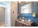 Bathroom featuring a marble countertop vanity with a decorative mirror and vintage accents at 174 Edward Ave., Murrells Inlet, SC 29576