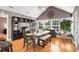 Bright dining room with vaulted ceilings, modern decor, large windows, and hardwood floors at 174 Edward Ave., Murrells Inlet, SC 29576