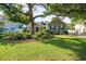 Charming home with a well-manicured lawn and mature trees providing shade and curb appeal at 174 Edward Ave., Murrells Inlet, SC 29576