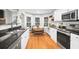 Open-concept kitchen with granite countertops, stainless steel appliances and views to a living room at 174 Edward Ave., Murrells Inlet, SC 29576