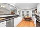 Bright kitchen featuring stainless steel appliances, granite countertops, and a view to the living room at 174 Edward Ave., Murrells Inlet, SC 29576