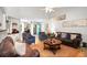 Spacious living area featuring a modern decor, hardwood floors, and plenty of seating at 174 Edward Ave., Murrells Inlet, SC 29576