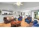 Open-concept living room with views to the kitchen and dining areas, plus hardwood floors at 174 Edward Ave., Murrells Inlet, SC 29576