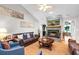 Cozy living room featuring a stone fireplace with mounted TV and comfortable seating at 174 Edward Ave., Murrells Inlet, SC 29576
