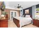 Spacious main bedroom featuring tray ceilings, modern decor, and private access to a porch at 174 Edward Ave., Murrells Inlet, SC 29576