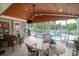 Covered porch with outdoor seating overlooking a pool with a fountain feature at 174 Edward Ave., Murrells Inlet, SC 29576